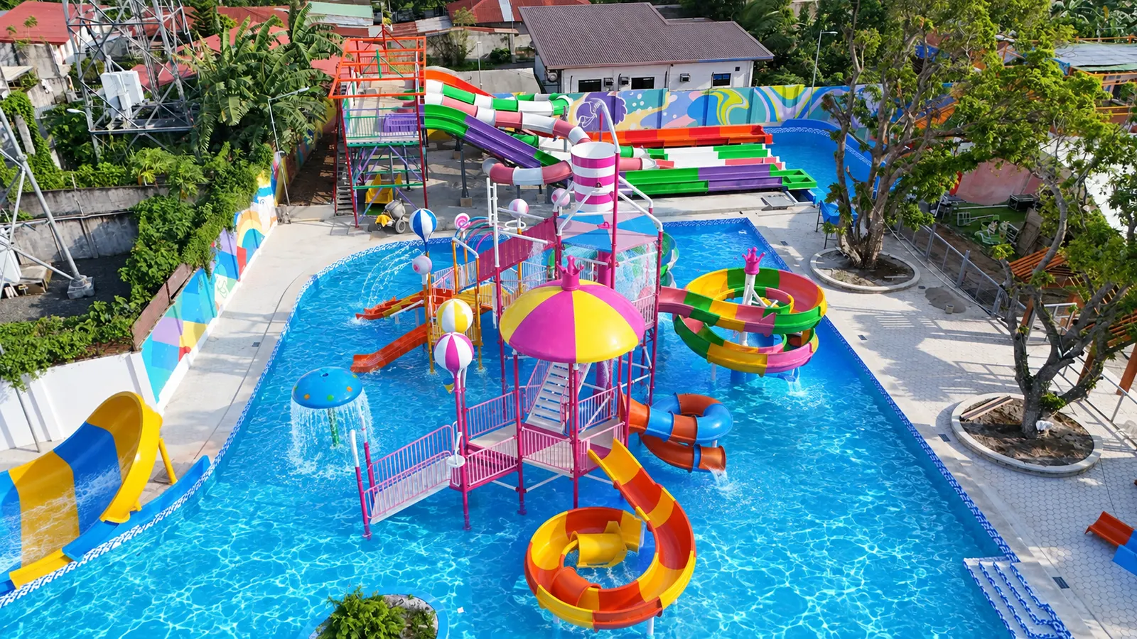 Kids' water play structure with colorful slides and pool